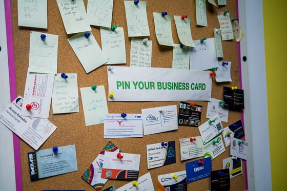 The Blooms member noticeboard covered in pinned business cards